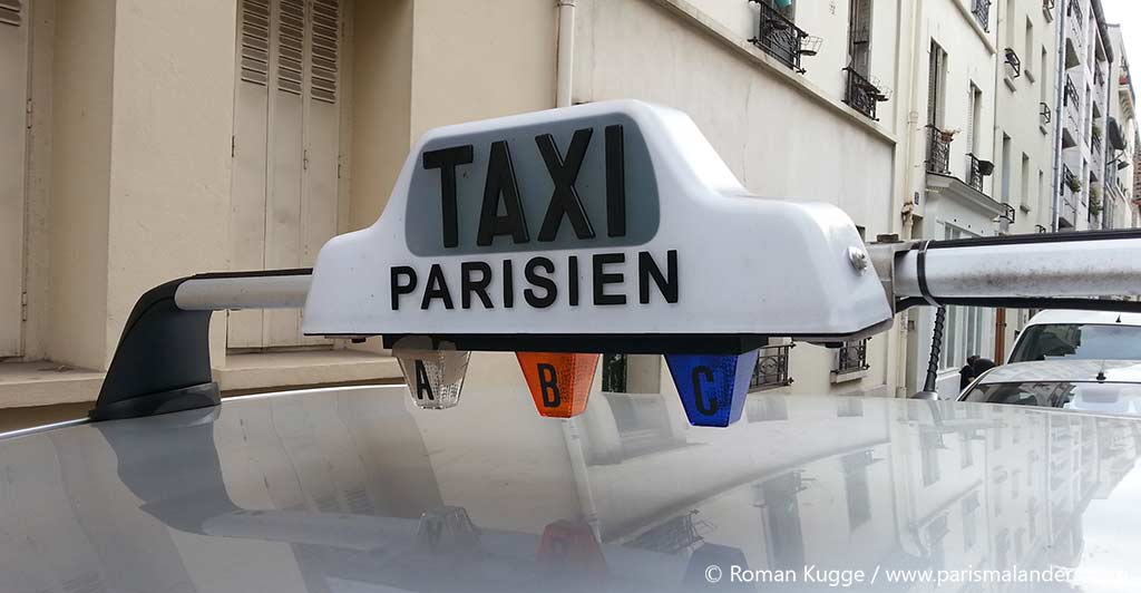https://www.parismalanders.com/wp-content/uploads/2016/11/Taxi-Schild-Paris-Dach-Auto.jpg